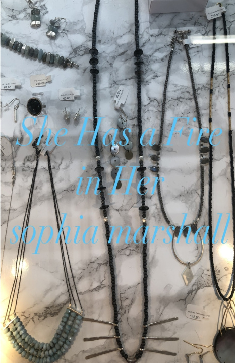 Книга She Has a Fire in Her Sophia Marshall